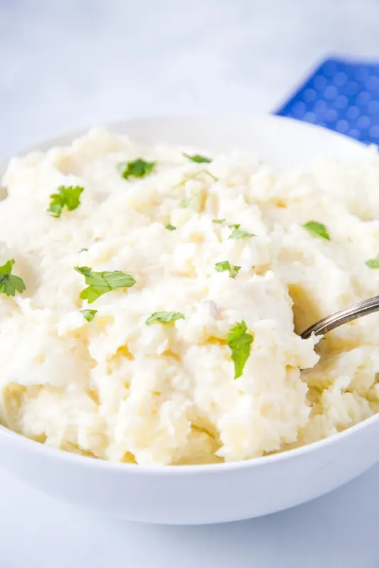 mashed potatoes in a bowl with a spoon