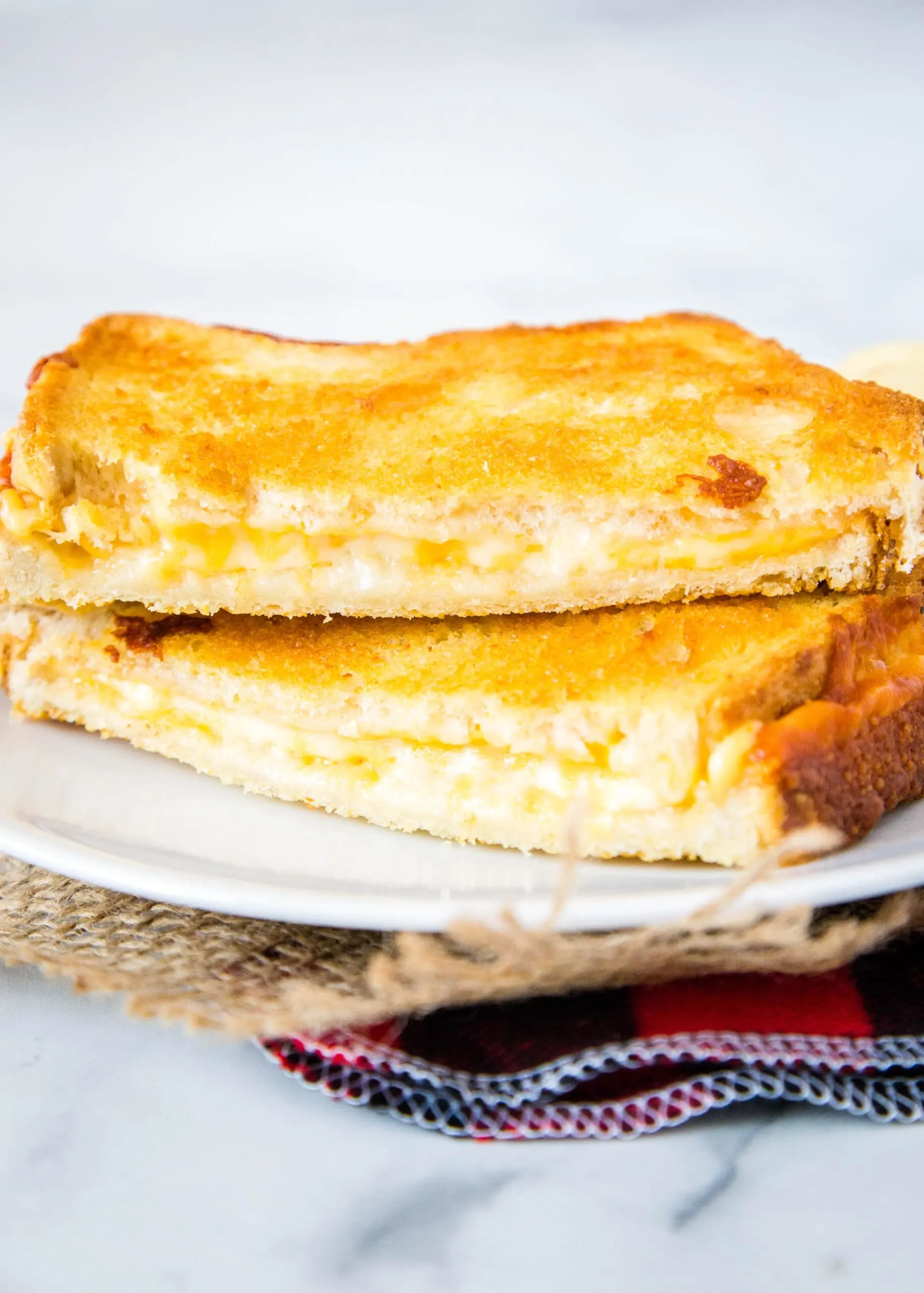 grilled cheese sandwich on a white plate
