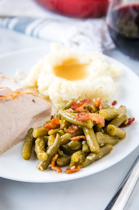 green beans on plate with turkey and mashed potatoes