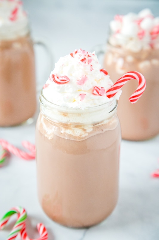 glass of peppermint hot chocolate topped with whipped cream