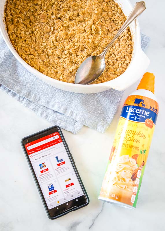 pumpkin crisp with can of whipped cream and safeway app on phone