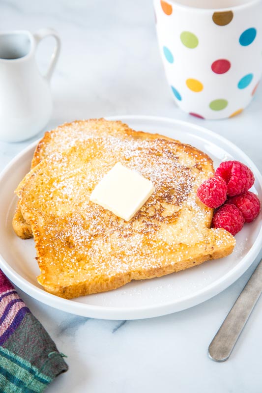 sourdough french toast on a plate topped with butter
