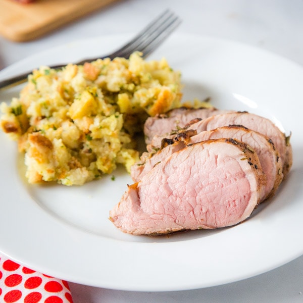 cropped pic of sliced pork tenderloin on plate with stuffing
