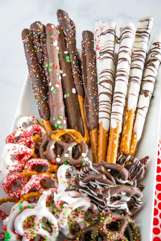 pretzel rods dipped in chocolate on platter