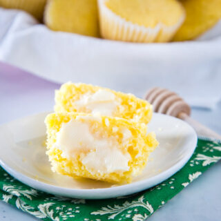 corn muffin with butter on white plate