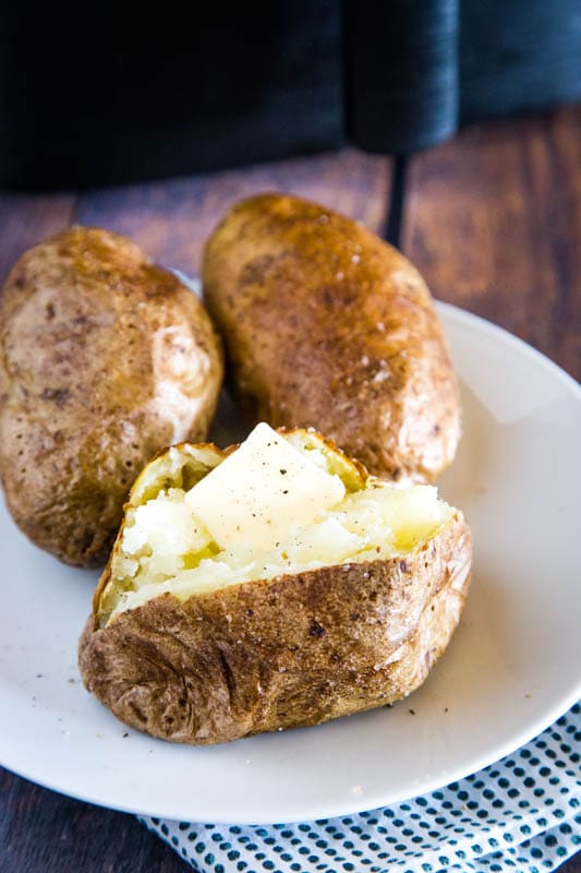 potato with pat of butter on it