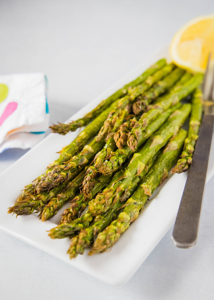 roasted asparagus on plate with fork
