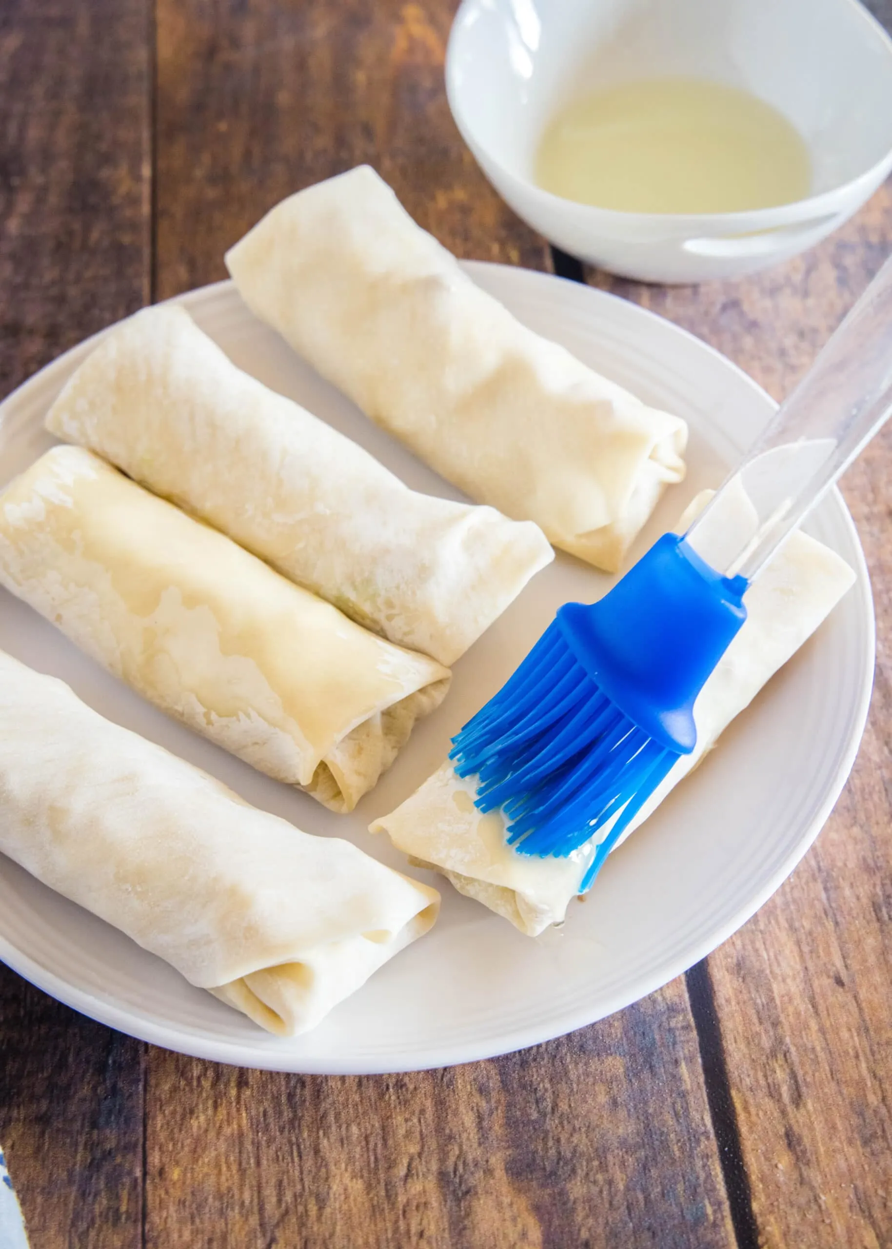 brush egg rolls with oil before putting in the air fryer