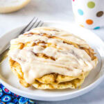 close up of stack of pancakes with cream cheese glaze