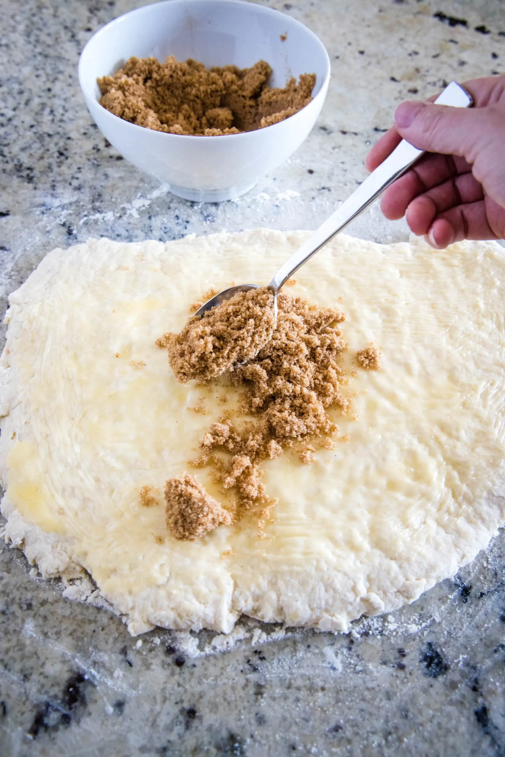 brown sugar filling being sprinkled on dough