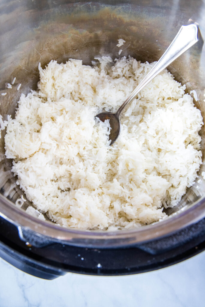 jasmine rice cooked in the instant pot fluffed and ready to serve