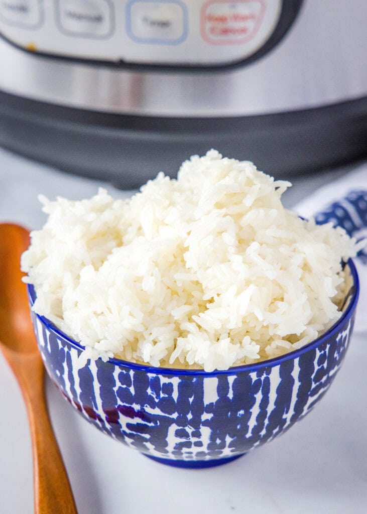 a bowl of white rice with Instant Pot in the background