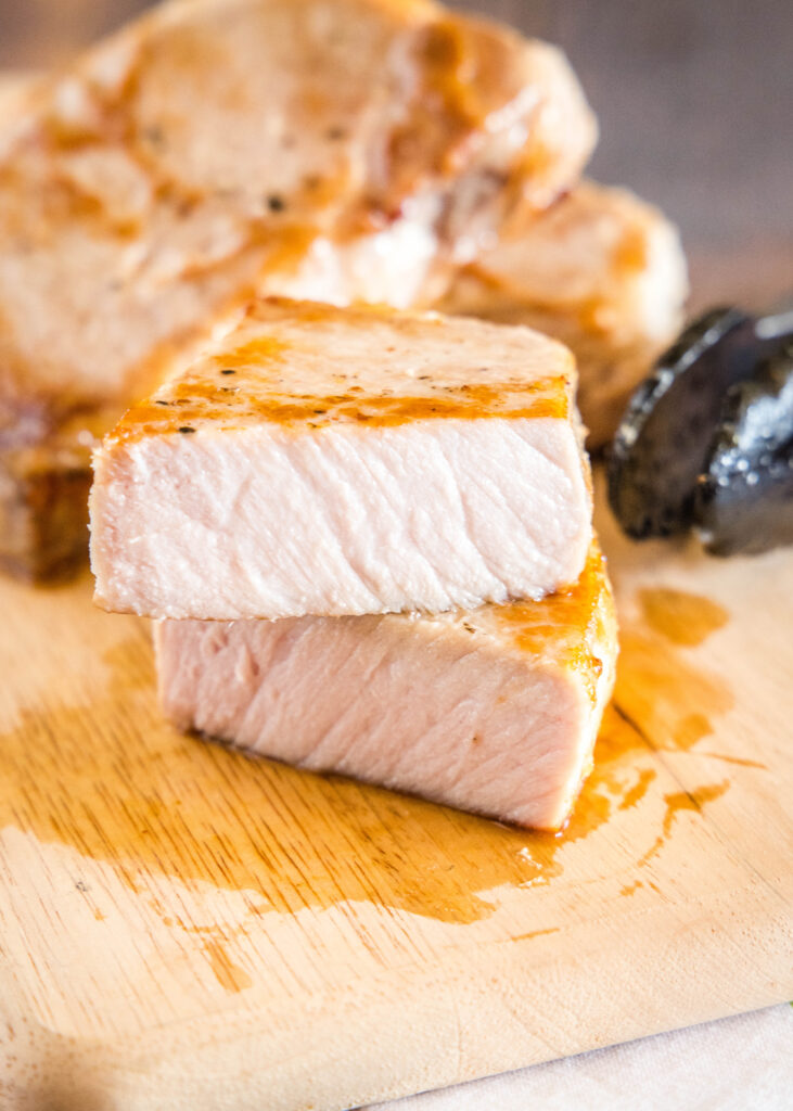 sliced pork chop on cutting board
