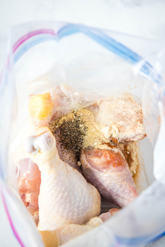 coating chicken legs in seasoning