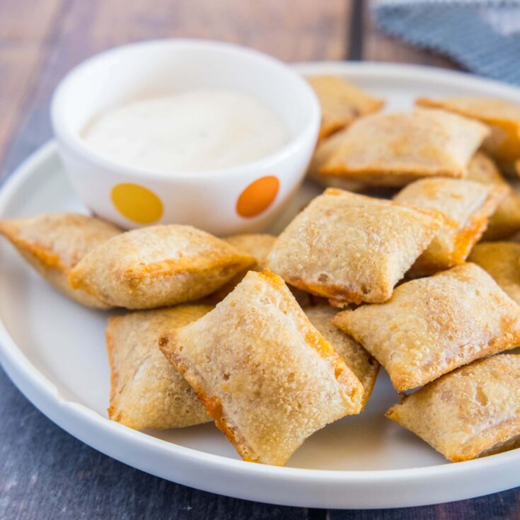 close up of pizza rolls on a plate