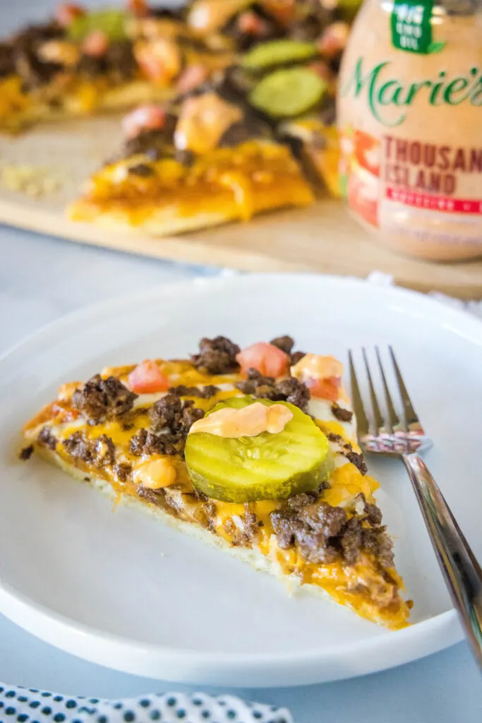 cheeseburger pizza slice on a plate