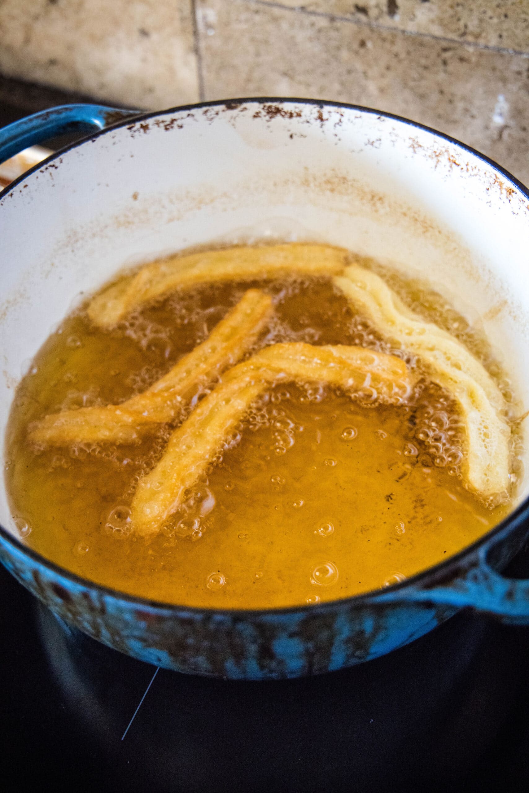frying churros in oil