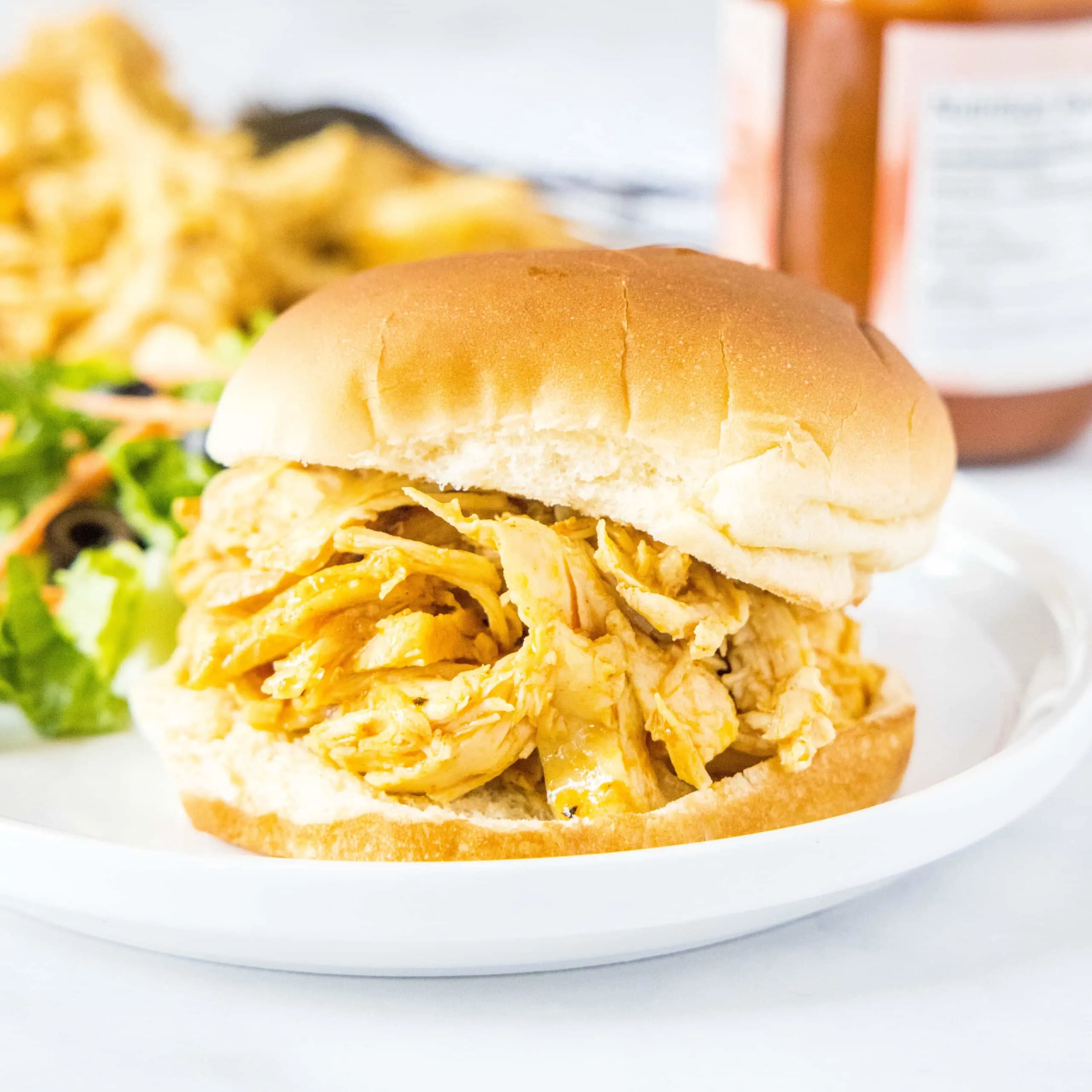 close up of shredded barbecue chicken sandwich
