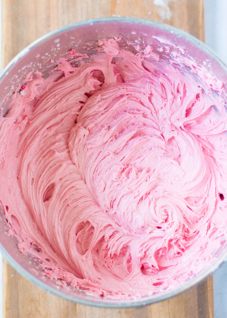 raspberry frosting in mixing bowl