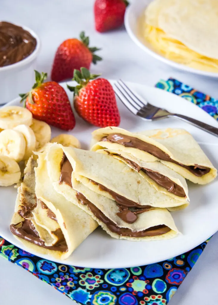 crepes filled with nutella on a plate