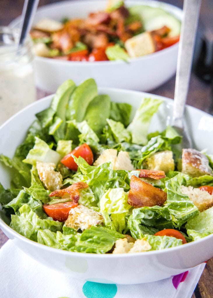 close up of blt salad tossed together in a bowl