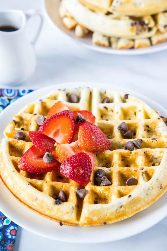 chocolate chip waffle on a plate with berries