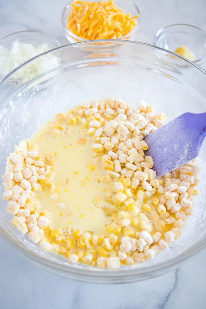 corn fritter batter being made in a bowl