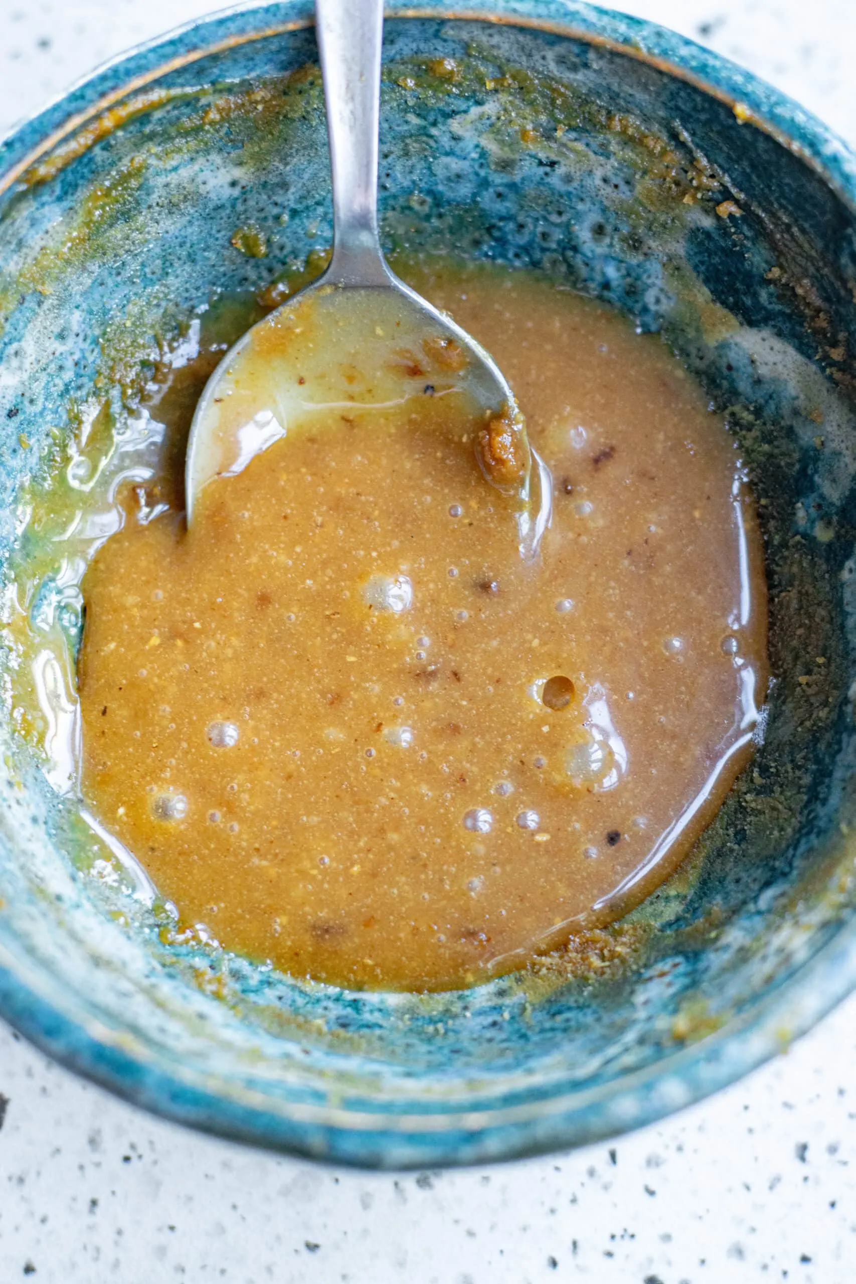 peanut dipping sauce in blue bowl