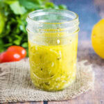 close up of greek vinaigrette in a jar