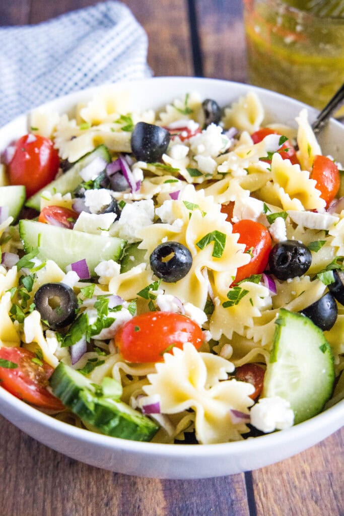 pasta salad mixed together in a bowl