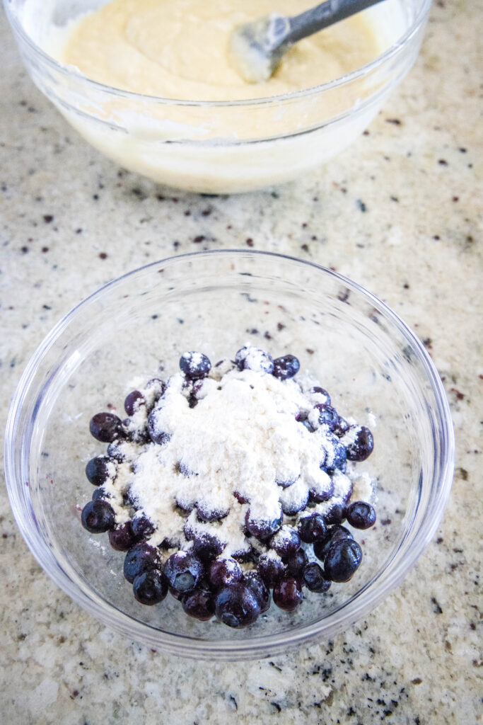 tossing blueberries in flour