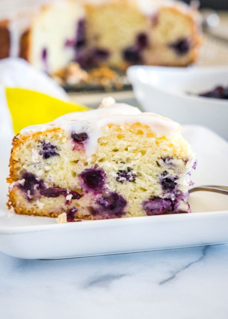 slice of lemon blueberry cake on a plate