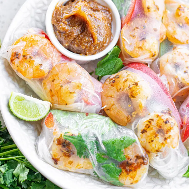 cropped square image of shrimp rolls on a plate