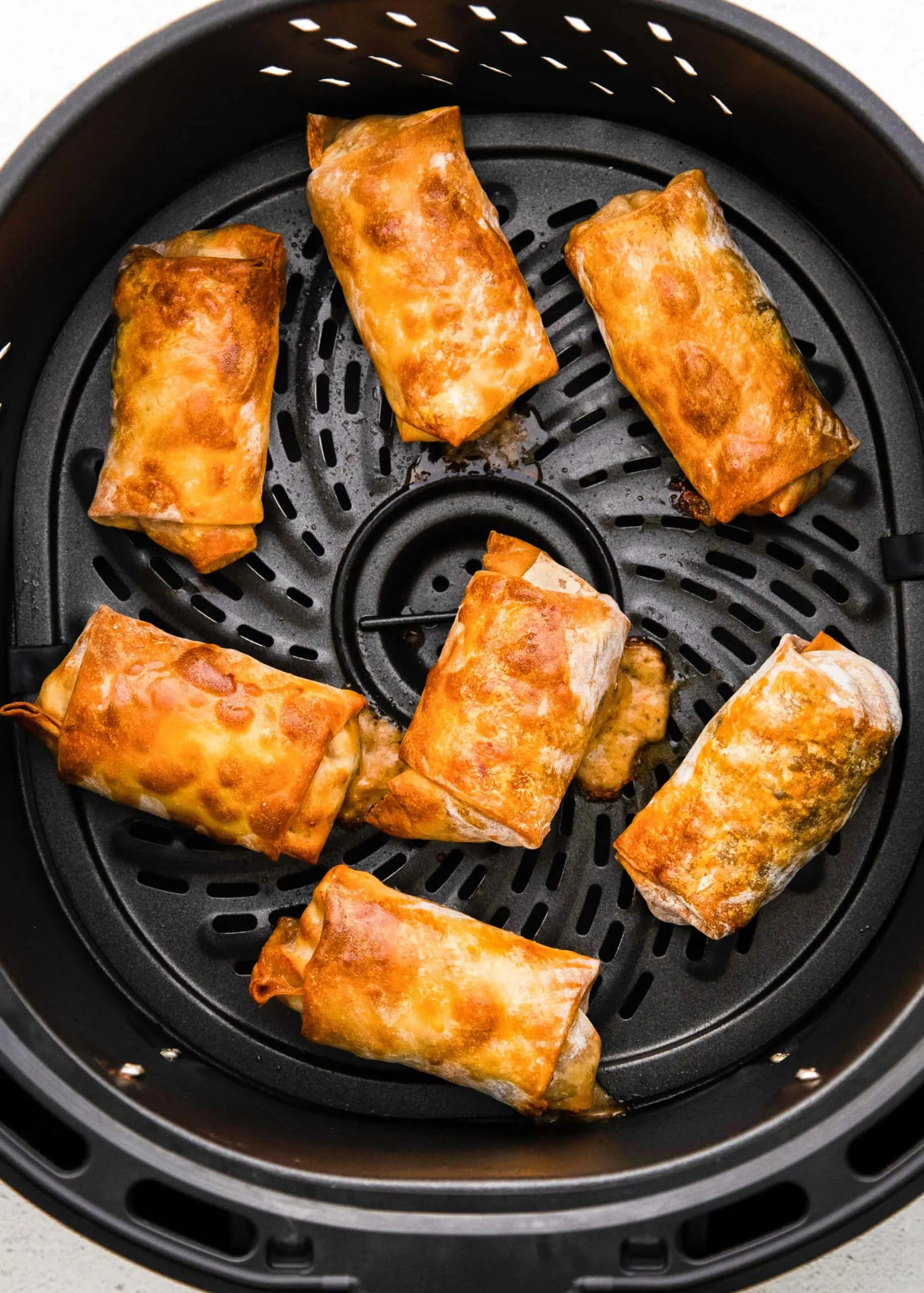cooked egg rolls in air fryer basket