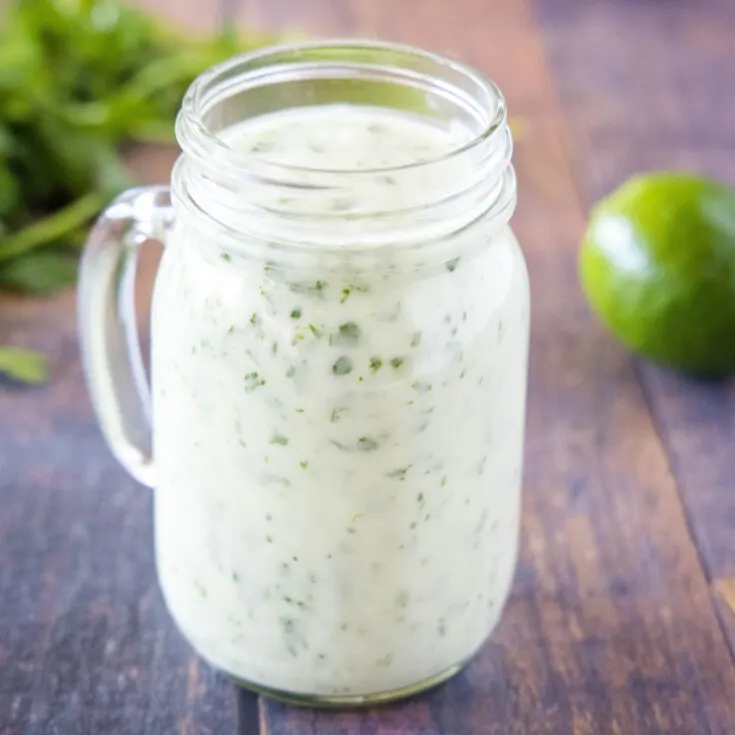 close up cilantro lime dressing in a jar