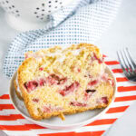 close up of a slice of strawberry bread on a plate