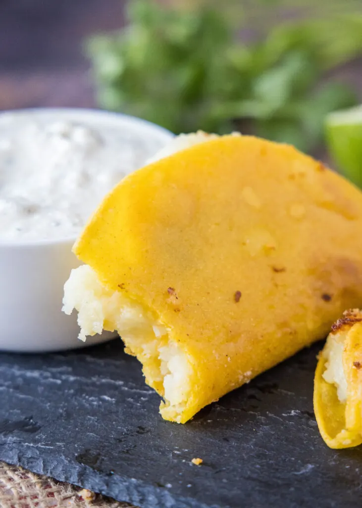 mashed potato tacos with a bite taken out of it