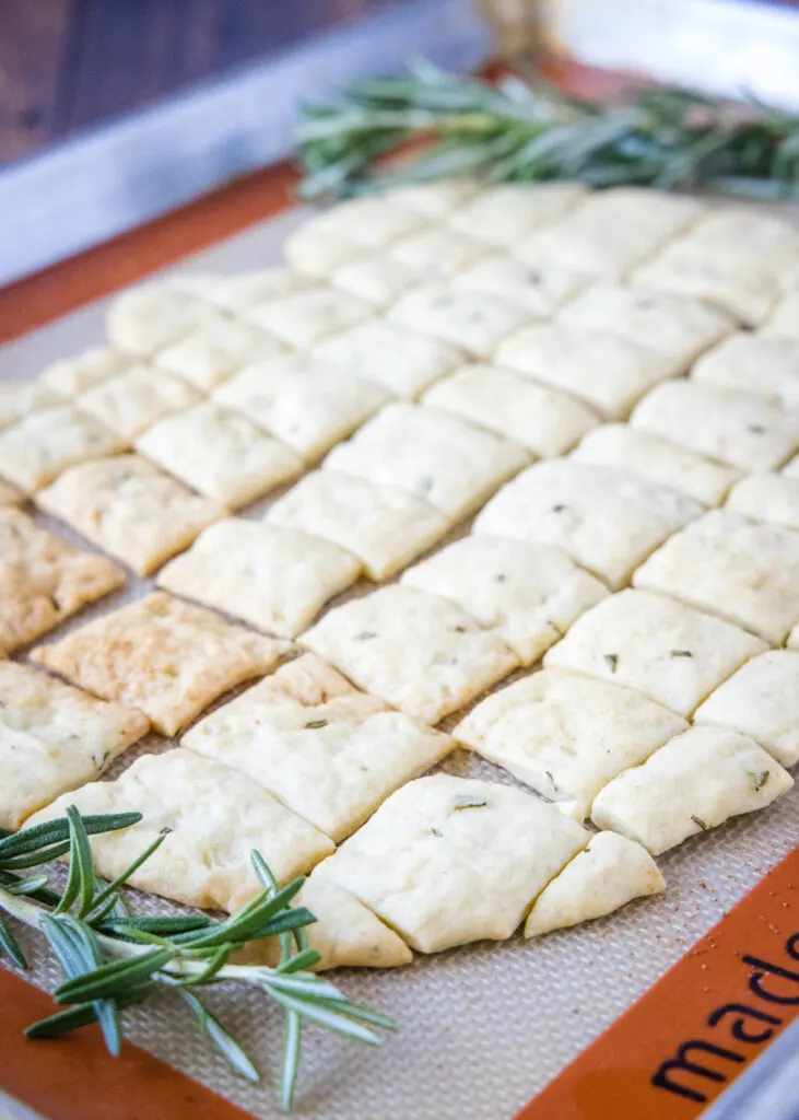 rosemary crackers on a baking mat