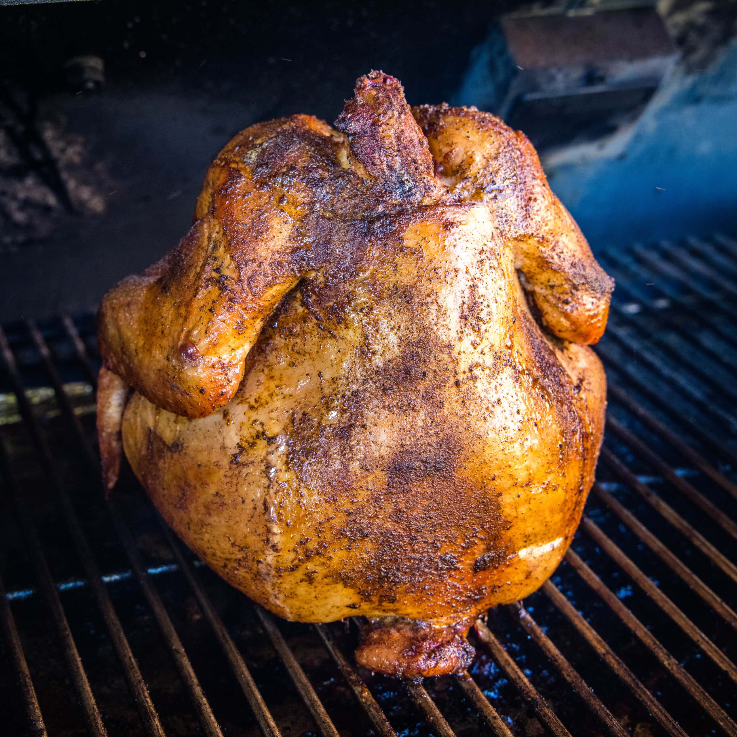 close up smoked beer can chicken on the smoker