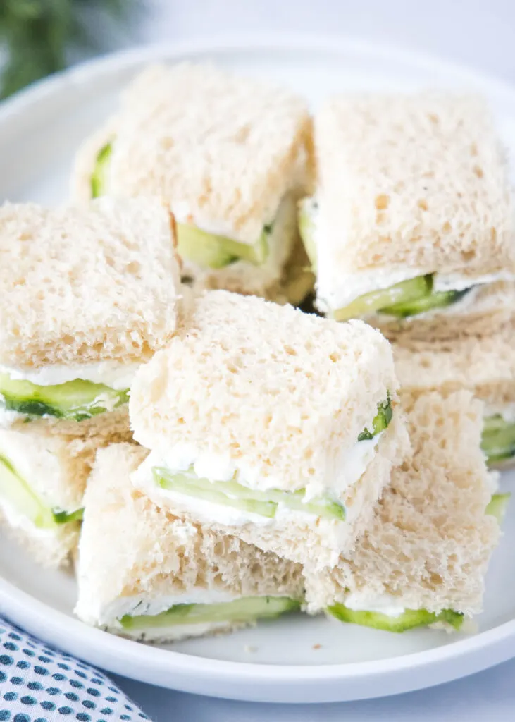 looking down on a plate of cucumber sandwiches