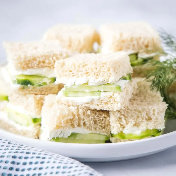 cropped in of a plate of cucumber tea sandwiches