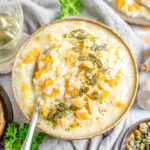 close up bowl of risotto with a spoon