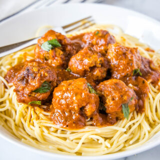 close up meatballs on spaghetti