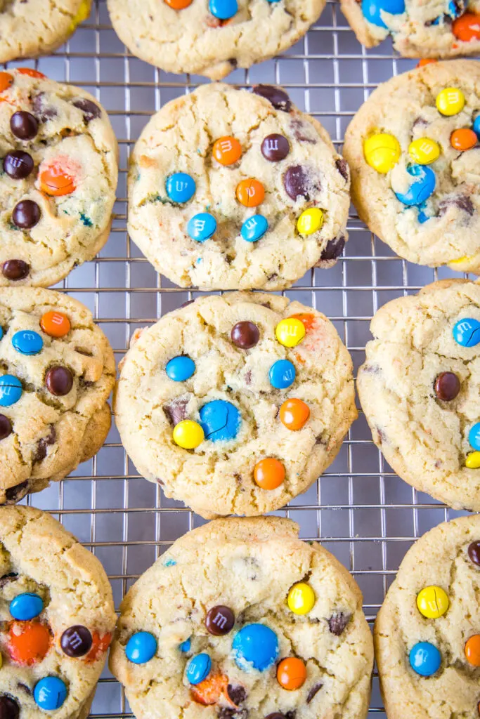 looking down on a cooling rack of M&M cookies
