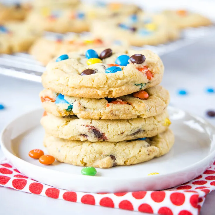 close up of cookies stacked on a white plate