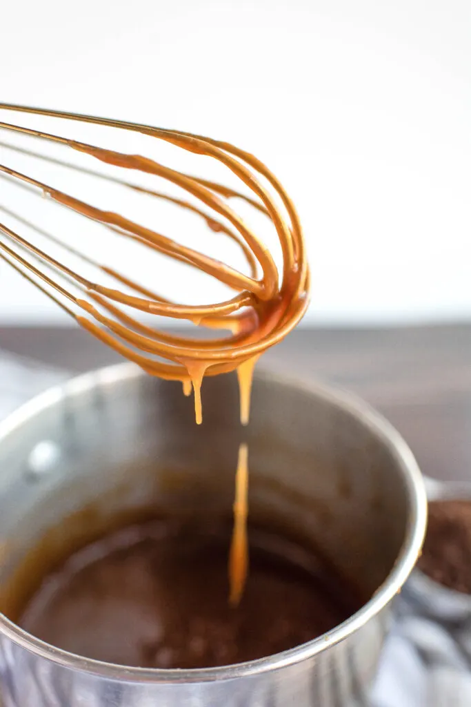 caramel sauce on a whisk