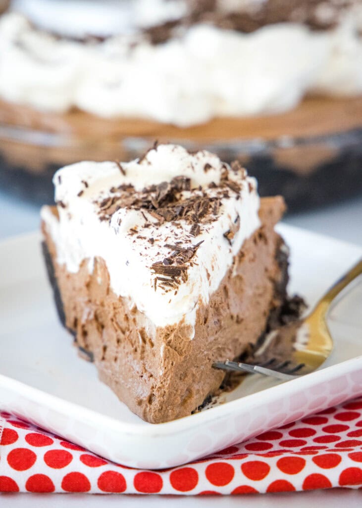 face on slice of death by chocolate cream pie on white plate