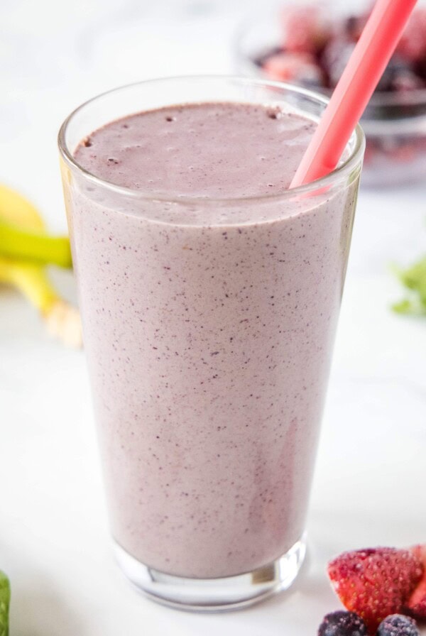 close up of mixed berry smoothie in a glass
