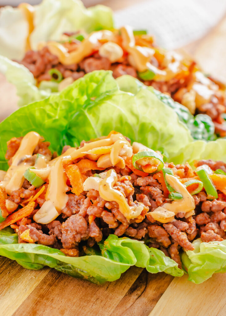 ground beef lettuce wraps on a cutting board