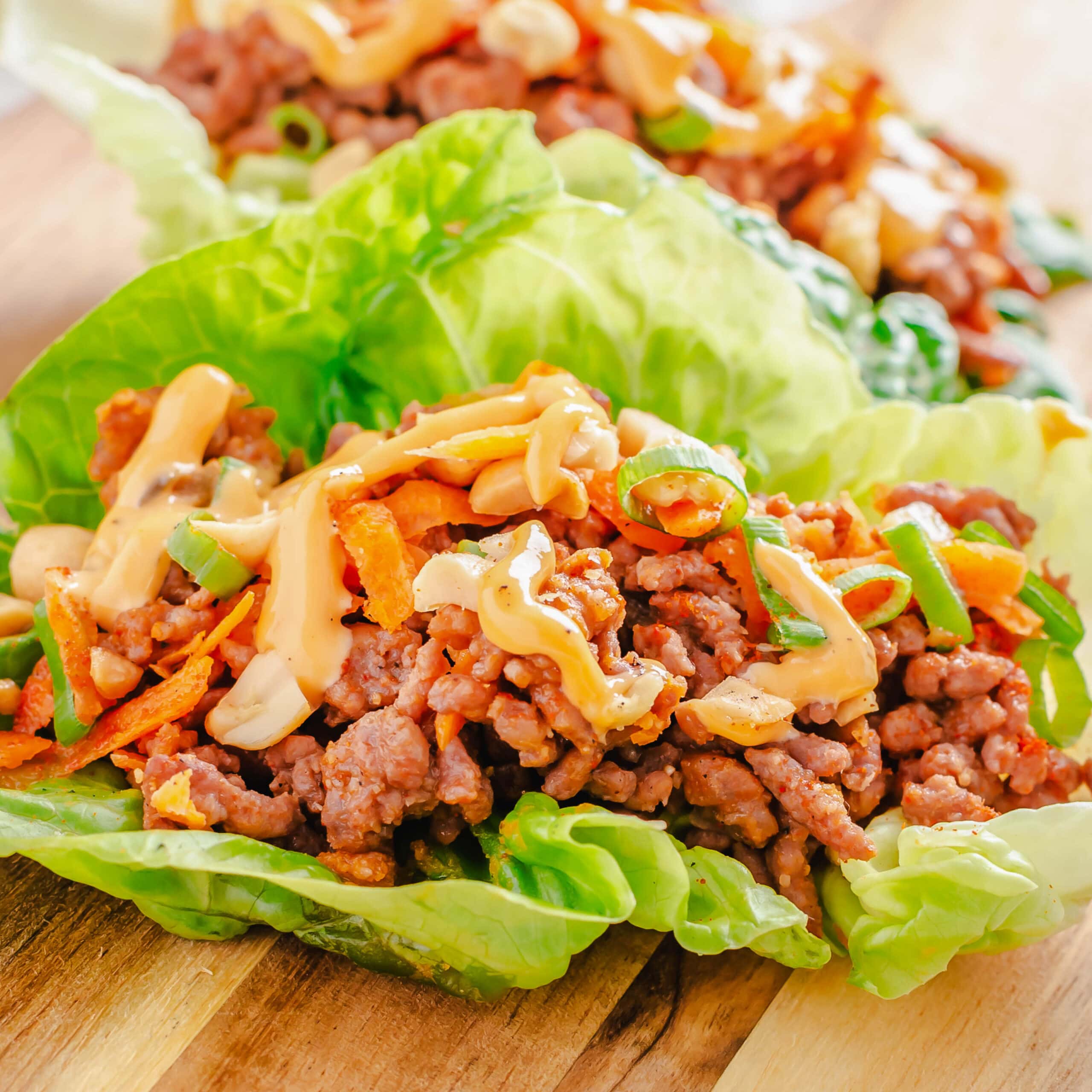 close up of lettuce wrap on a cutting board